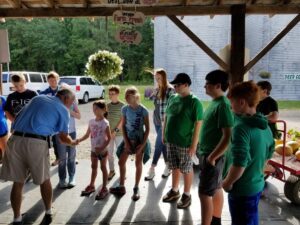 Campers listening to man speak